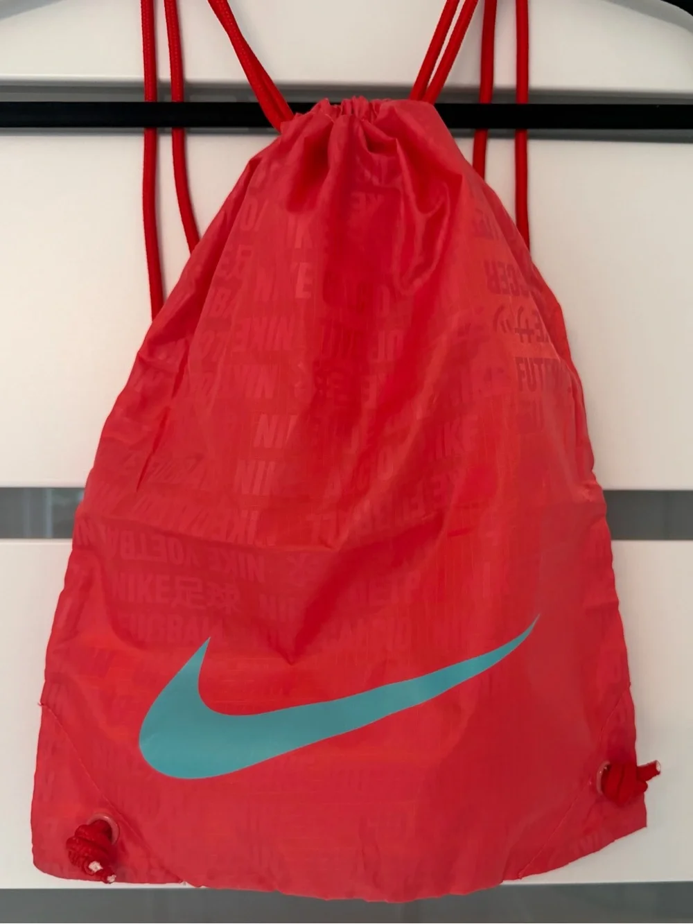 Nike Red Drawstring Backpack with Gray Swoosh